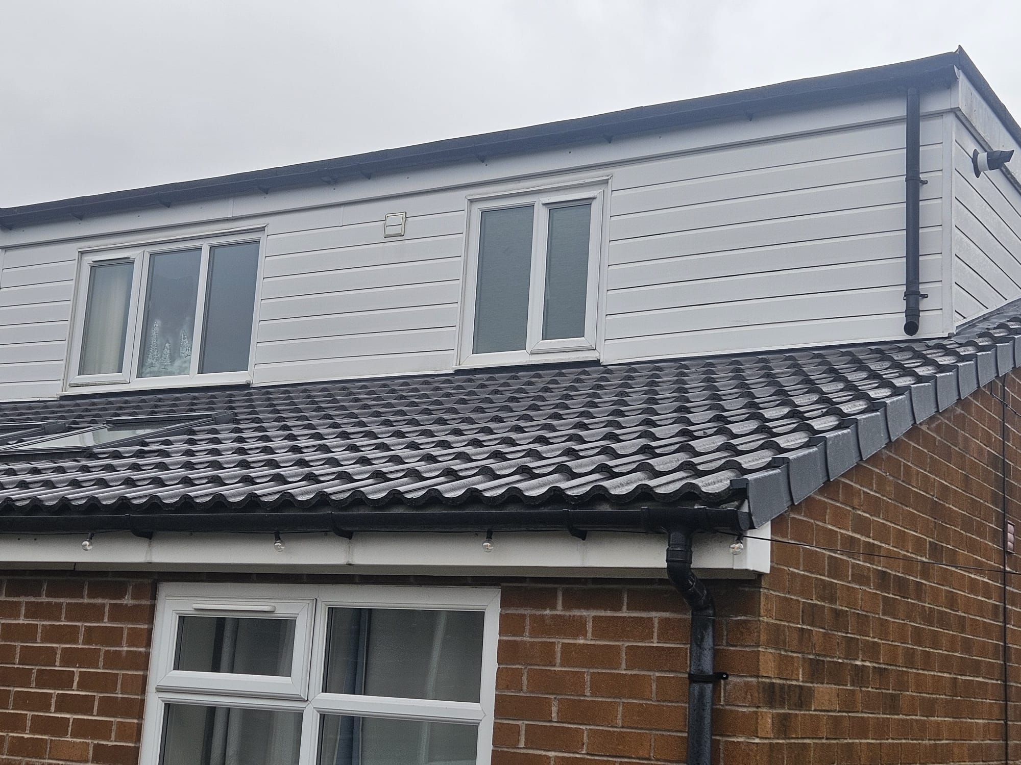 White uPVC Cladding & Tiled Roof